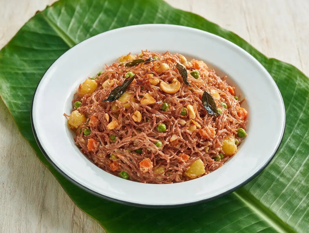 Russet Navara red rice vermicelli biryani with coconut masala and fried cashews