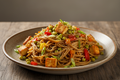 Sprouted little millet noodles with paneer and sautéed vegetables