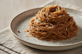 Sprouted ragi vermicelli served with jaggery, grated coconut and cardamom